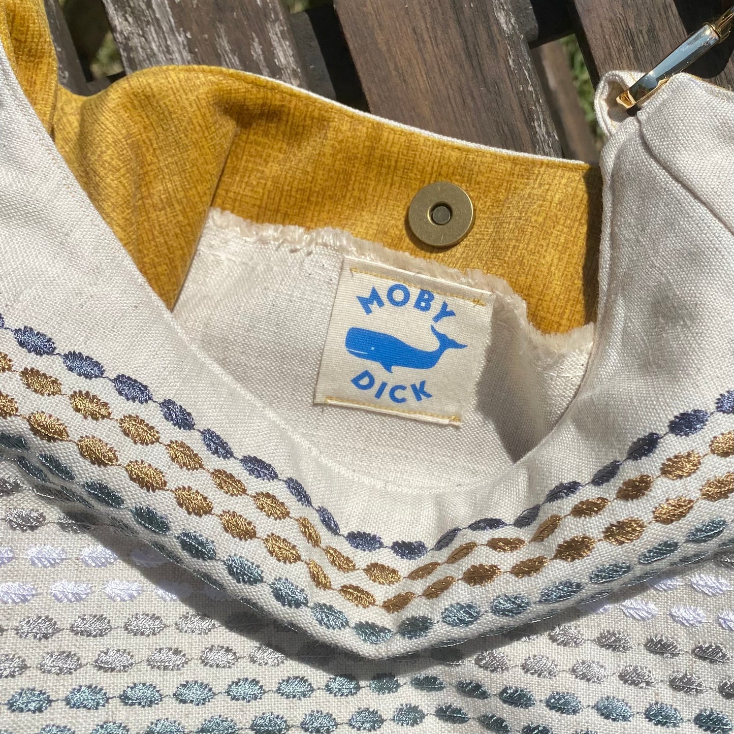 Bolso detalle colores con asa de cuero