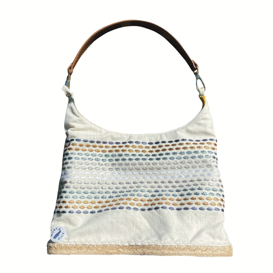 Bolso detalle colores con asa de cuero